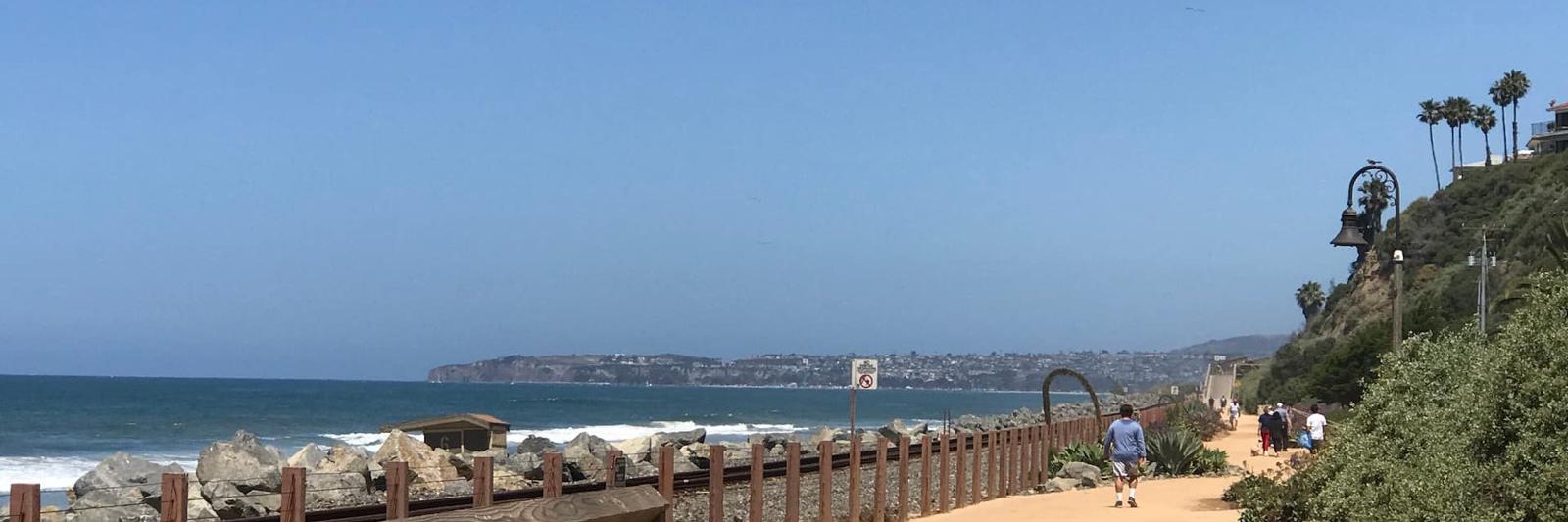 The San Clemente Beach Trail running between the sand and the railway