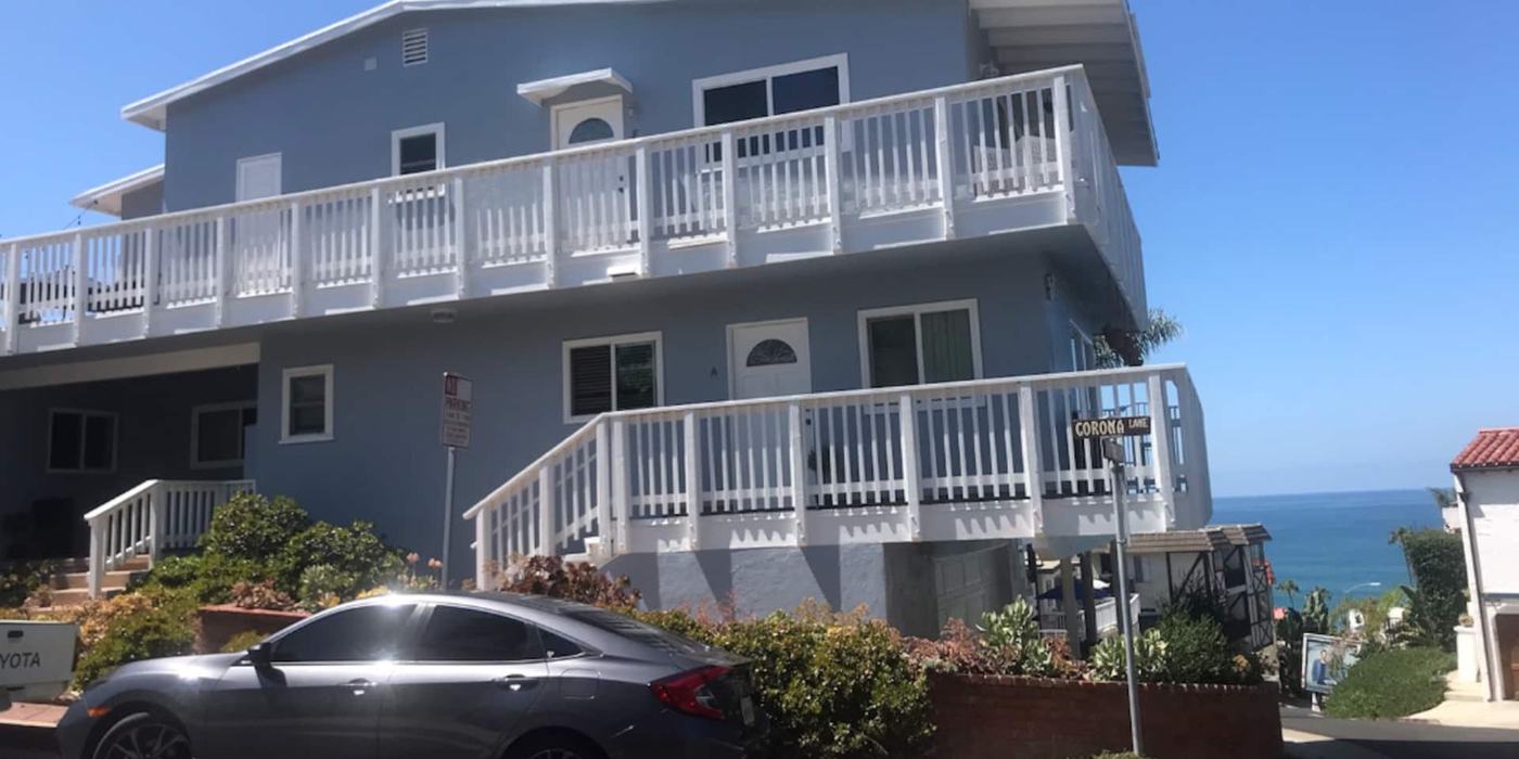 The Blue Whale Inn from Monterey Lane, with the ocean at the end of the street