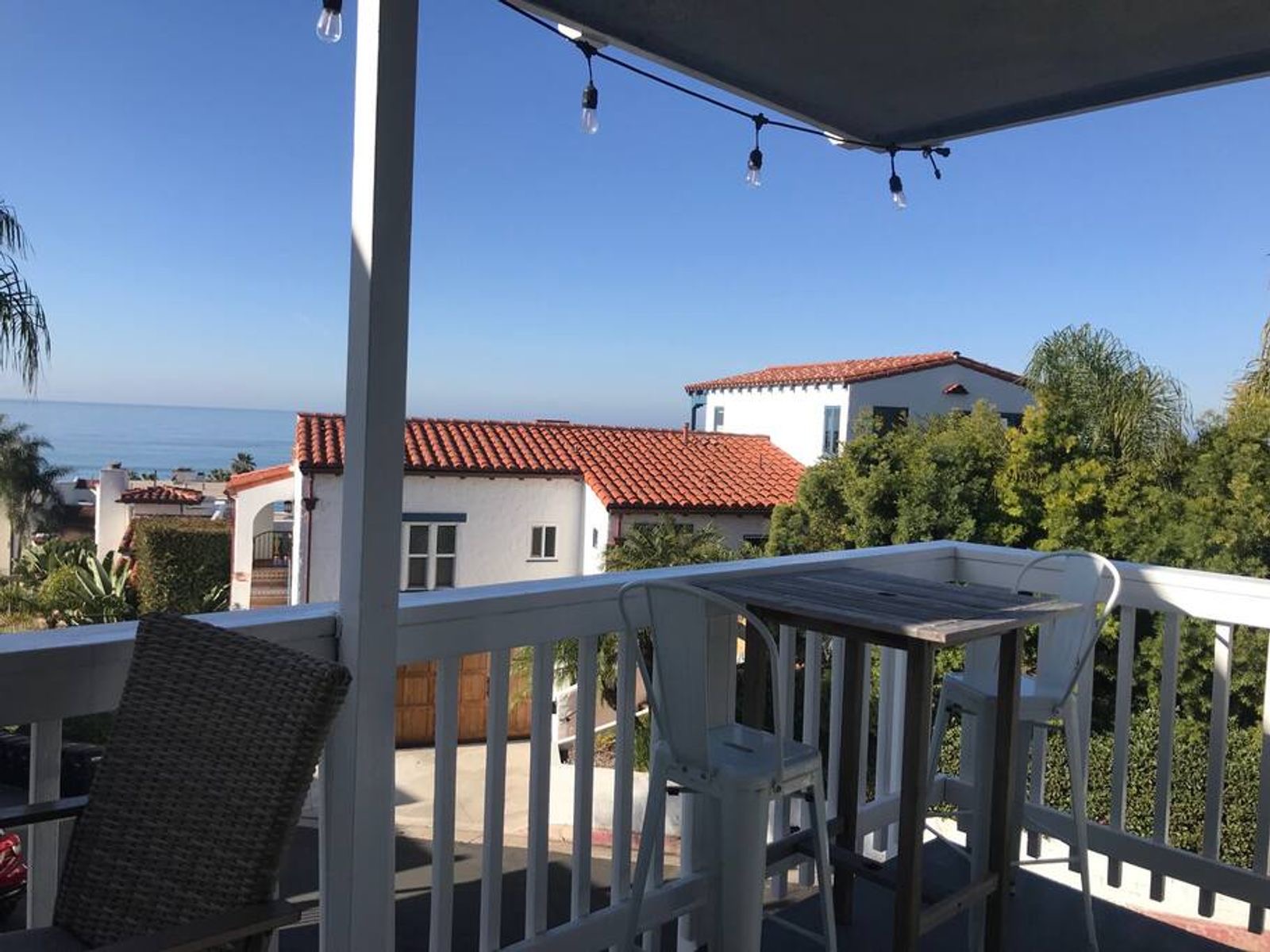 The Charmer (Unit A) — balcony evening